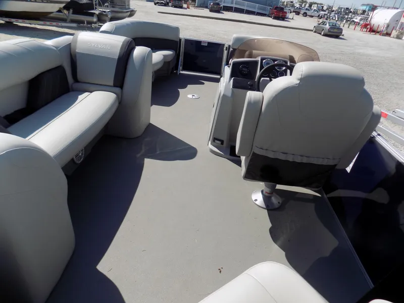 Slide: The Image of 2022 Sylvan Mirage Fish 8522 Party Fish interior with spacious seating and helm. - 6