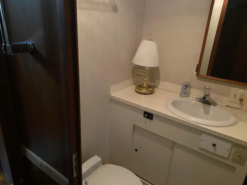 Slide: The Image of Bathroom interior of 1983 Hatteras 53 Extended Deckhouse Motor Yacht with sink and lamp. - 16