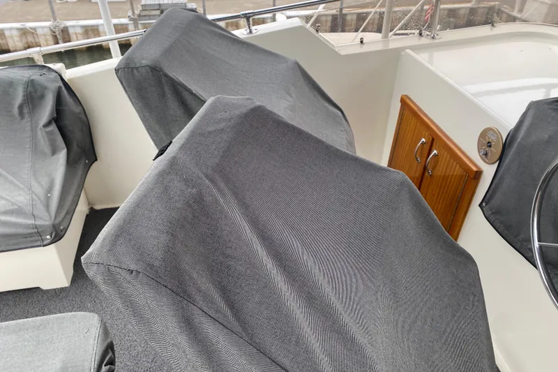 Slide: The Image of Covered seating area on 1983 Hatteras 53 Extended Deckhouse Motor Yacht. - 28