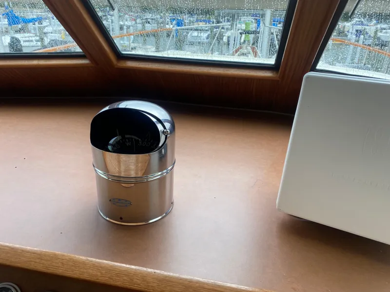 Slide: The Image of Interior of 1983 Hatteras 53 Motor Yacht with compass and window view. - 6