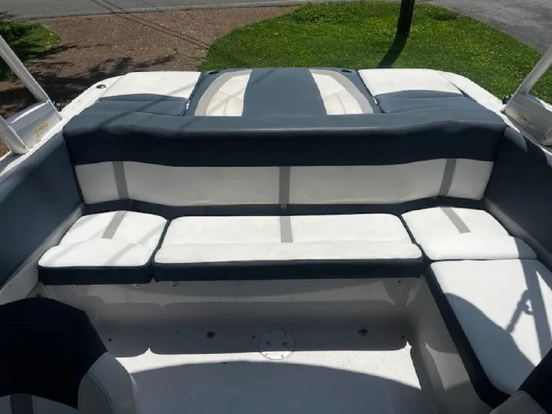 Slide: The Image of 2015 Four Winns H200 boat interior with cushioned seating and sleek design. - 13