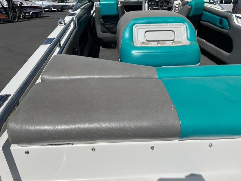 Slide: The Image of 1991 MasterCraft Maristar210 boat interior with teal and gray seating. - 12