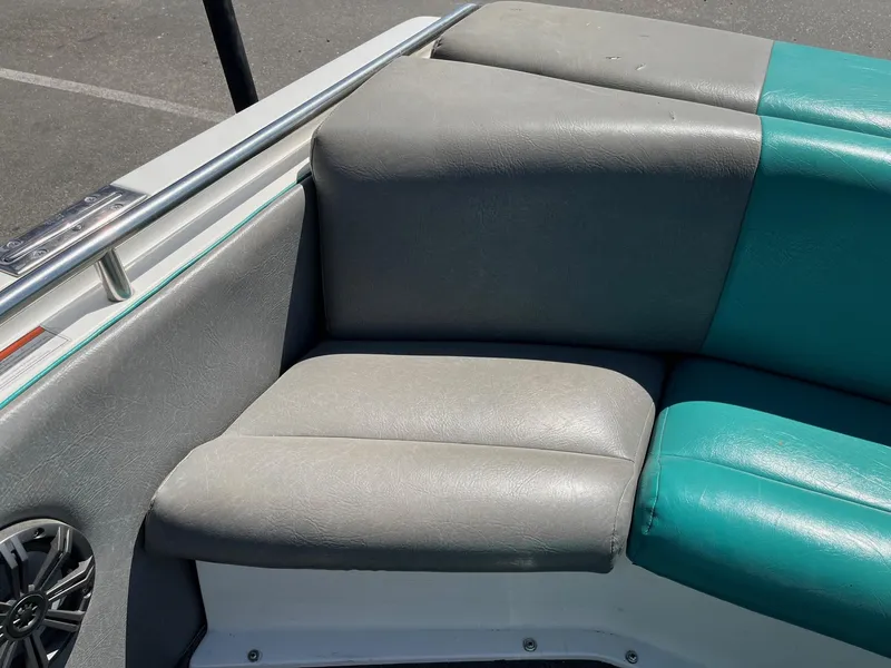 Slide: The Image of 1991 MasterCraft Maristar210 boat interior with gray and teal seating. - 15
