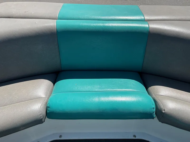 Slide: The Image of 1991 MasterCraft Maristar210 boat seat with teal and gray upholstery. - 16