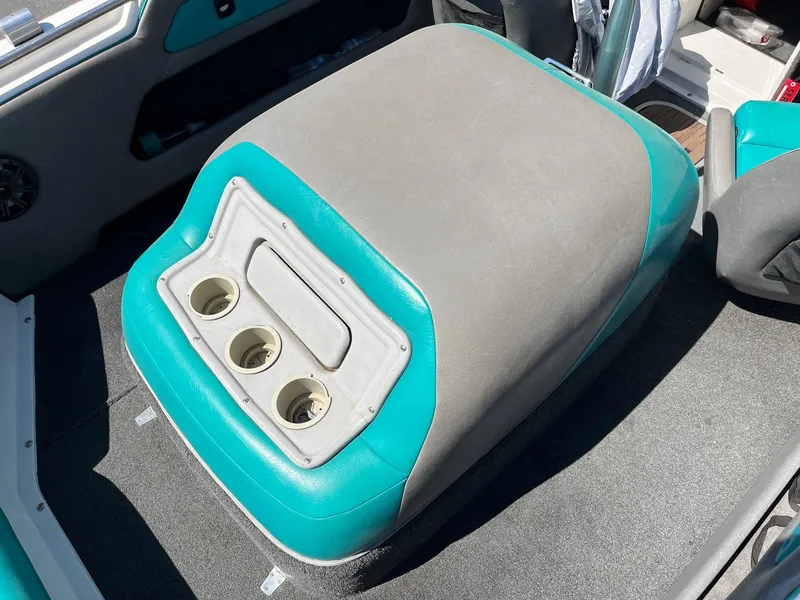 Slide: The Image of 1991 MasterCraft Maristar 210 boat interior with teal and gray upholstery and cup holders. - 18