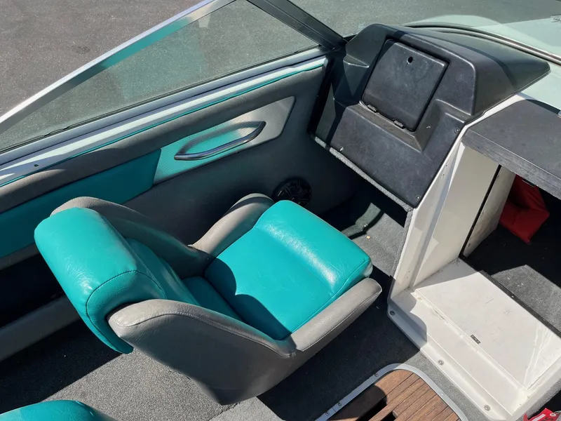 Slide: The Image of 1991 MasterCraft Maristar210 boat interior with teal and gray seating. - 20