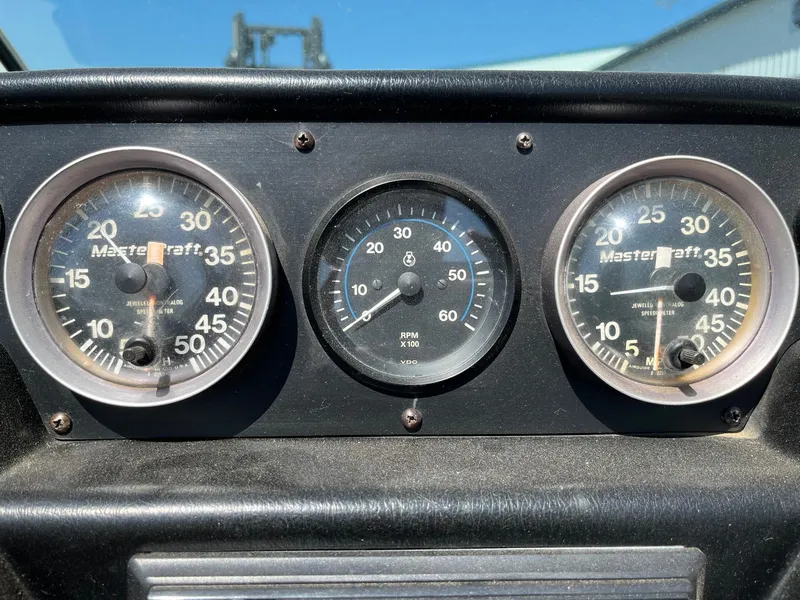 Slide: The Image of Dashboard gauges of a 1991 MasterCraft Maristar210 boat. - 24