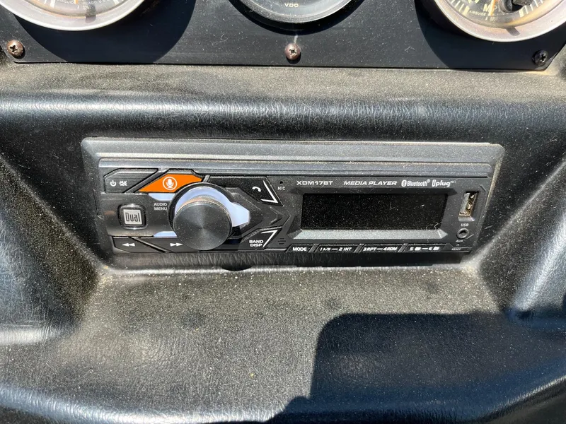 Slide: The Image of 1991 MasterCraft Maristar210 dashboard with media player and control panel. - 27