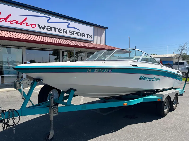 Slide: The Image of 1991 MasterCraft Maristar 210 boat on trailer outside Idaho Water Sports store. - 3