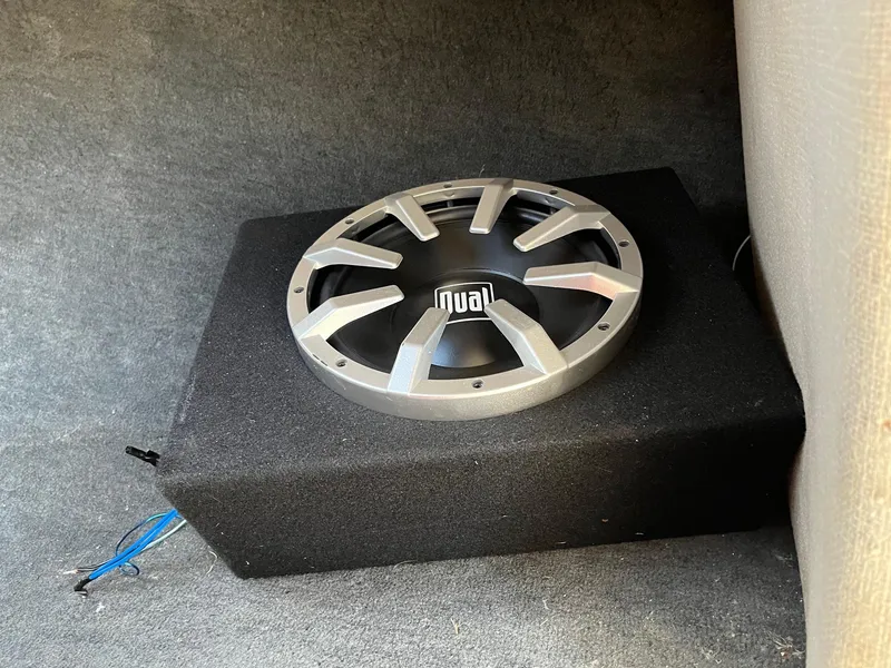 Slide: The Image of Subwoofer in a 1991 MasterCraft Maristar210 boat, installed on a carpeted surface. - 30