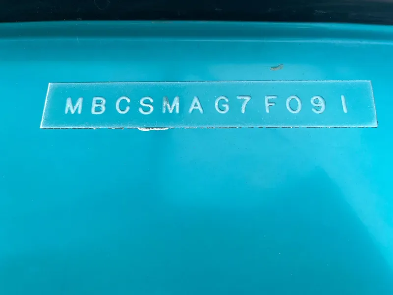 Slide: The Image of 1991 MasterCraft Maristar210 boat hull identification number on blue surface. - 33