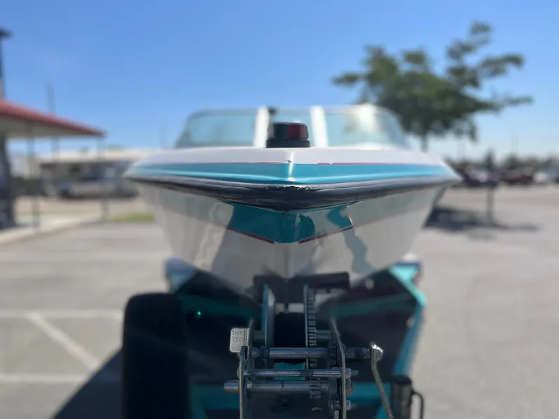 Slide: The Image of 1991 MasterCraft Maristar210 boat on trailer, close-up front view in parking lot. - 4