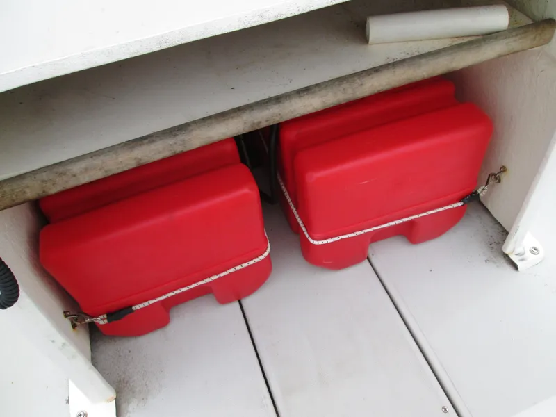 Slide: The Image of Red fuel tanks on a 1975 Tripp Center Console boat. - 4