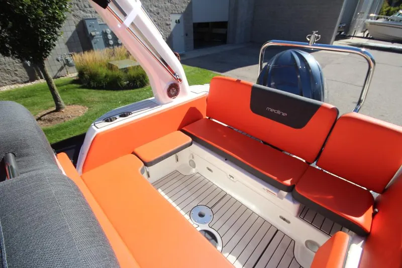 Slide: The Image of 2022 Zodiac Medline 7.5 boat with orange seating and sleek design. - 13