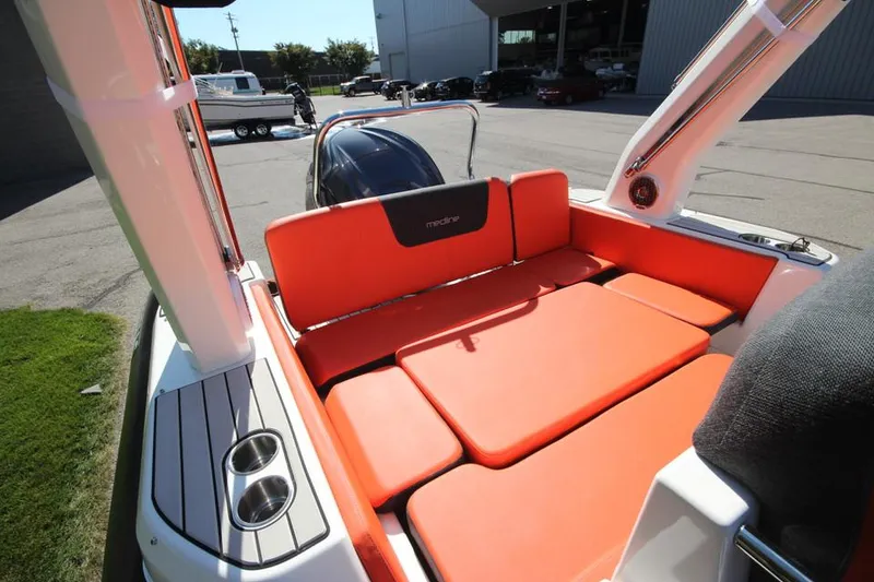 Slide: The Image of 2022 Zodiac Medline 7.5 NEO boat with orange seating and 300hp engine. - 15