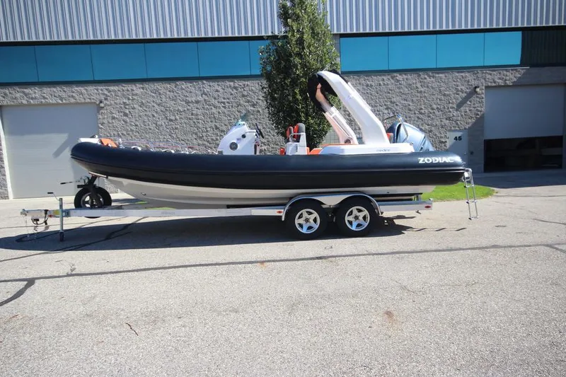 Slide: The Image of 2022 Zodiac Medline 7.5 NEO 300hp boat on trailer, parked outdoors. - 3