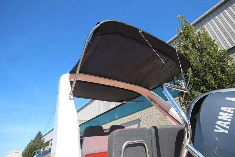 Slide: The Image of 2022 Zodiac Medline 7.5 NEO boat with canopy, 300hp engine, outdoor setting. - 31