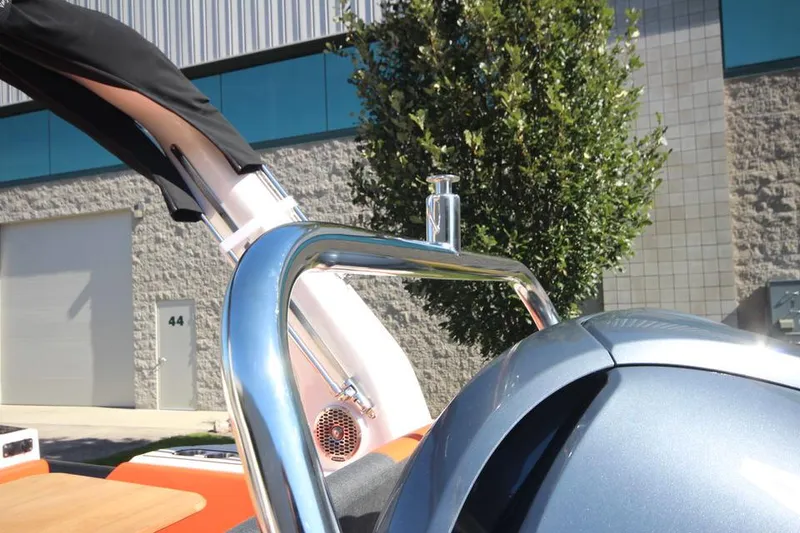 Slide: The Image of 2022 Zodiac Medline 7.5 NEO boat detail with chrome railing and modern design. - 9