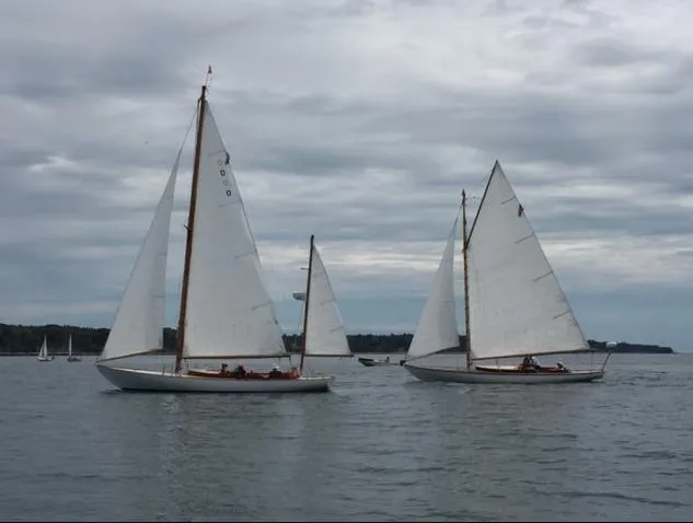 Slide: The Image of Two Buzzards Bay 25 sailboats from 1914 sailing on a cloudy day. - 22
