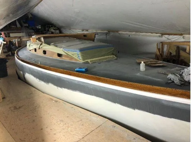 Slide: The Image of 1971 Little Harbor sailboat under restoration in a workshop. - 3