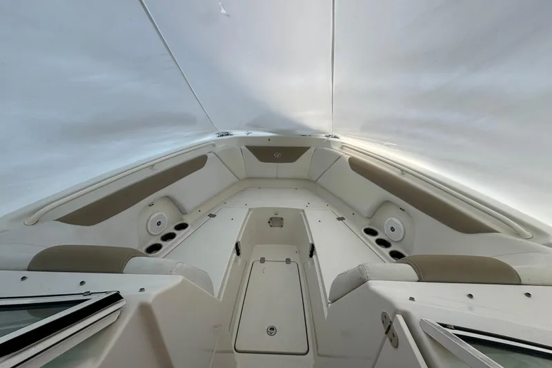 Slide: The Image of 2015 Sailfish 275 DC boat interior with seating and cup holders. - 10