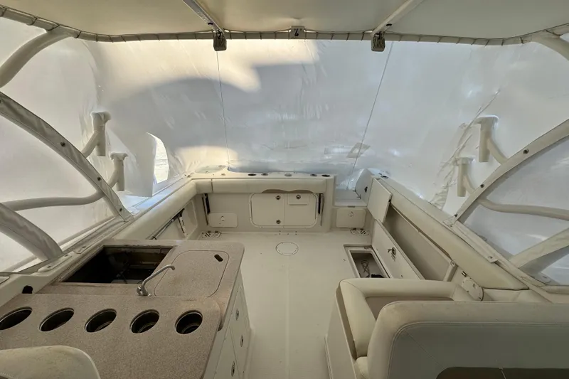 Slide: The Image of Interior of 2015 Sailfish 275 DC boat with seating and storage compartments. - 15
