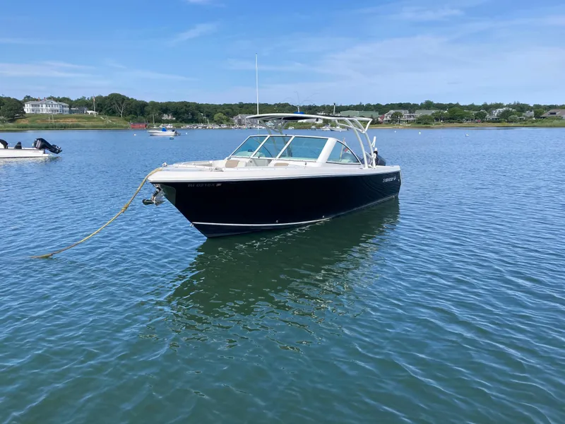 Slide: The Image of 2015 Sailfish 275 DC boat on calm water. - 3