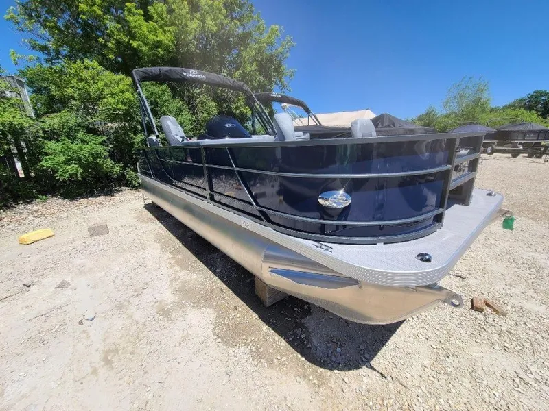 Slide: The Image of 2022 Veranda VF22F4 Deluxe Tri-Toon boat on a gravel lot with trees in the background. - 10