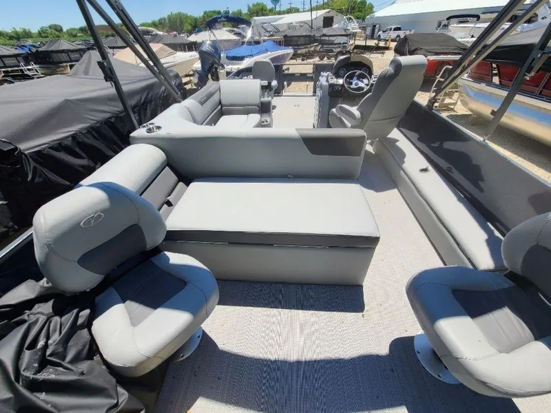Slide: The Image of 2022 Veranda VF22F4 Deluxe Tri-Toon boat interior with gray seating and helm. - 4
