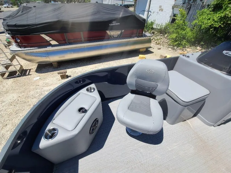 Slide: The Image of 2022 Veranda VF22F4 Deluxe Tri-Toon boat interior with seating and storage. - 8