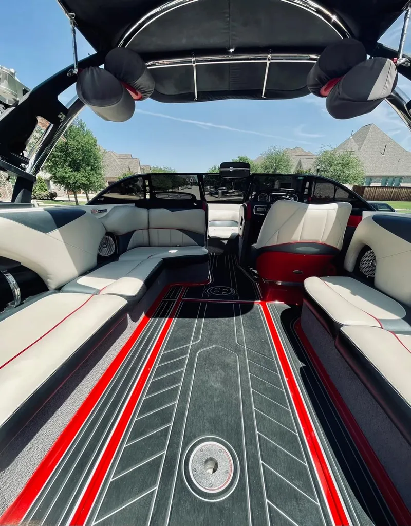 Slide: The Image of Interior of a 2013 Malibu 247LSV boat with stylish seating and modern design. - 7