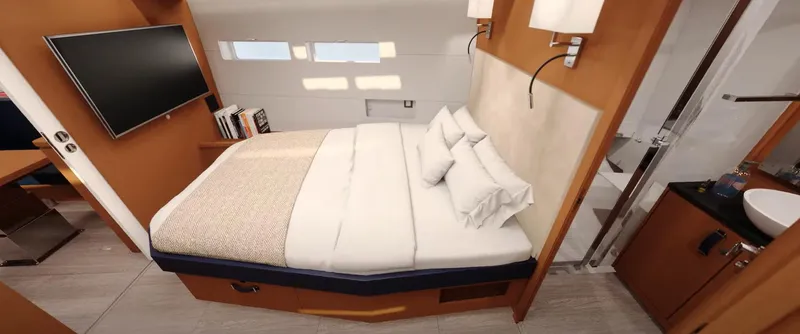 Slide: The Image of Luxurious cabin interior of 2024 Jeanneau Yacht 55 with bed, TV, and ensuite bathroom. - 15