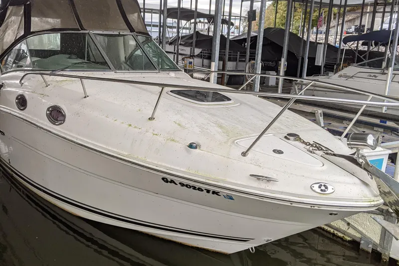 Slide: The Image of 2005 Sea Ray 260 Sundancer docked in a marina. - 1
