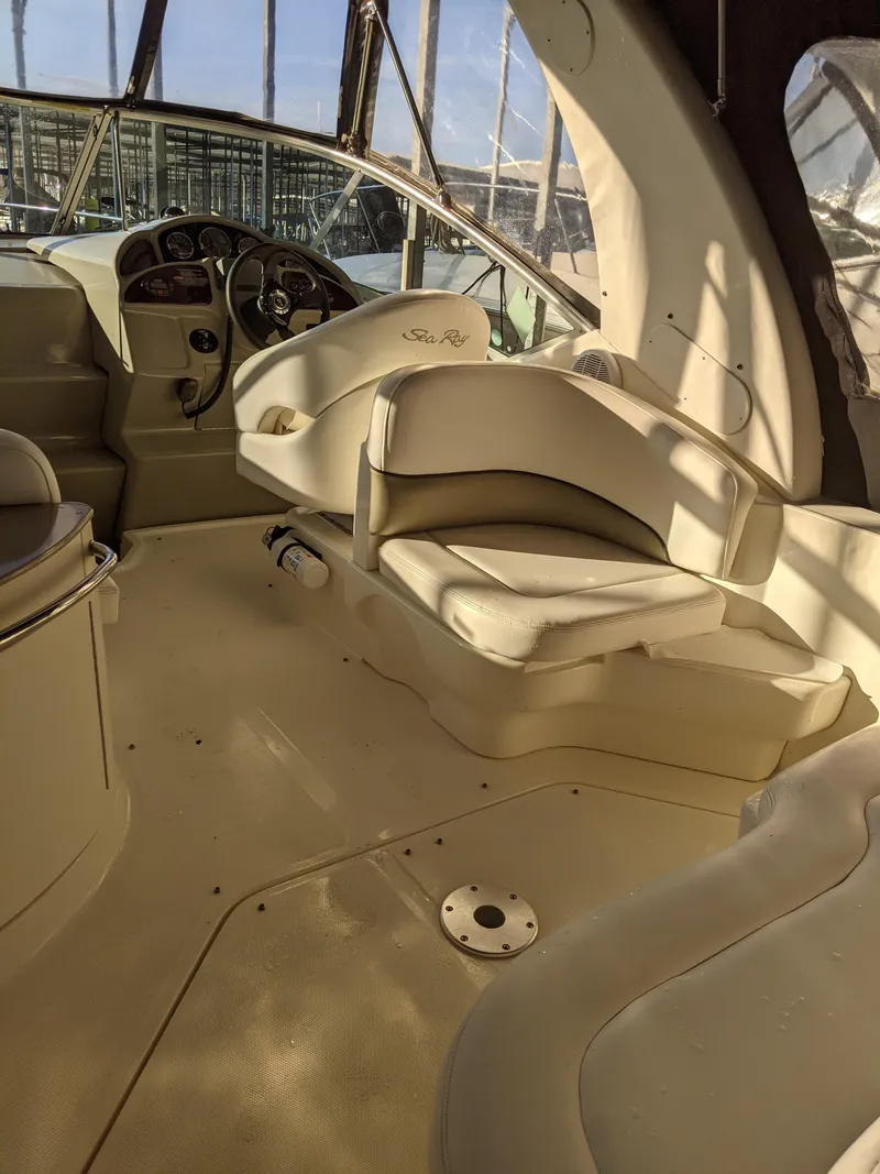 Slide: The Image of 2005 Sea Ray 260 Sundancer docked under covered marina. - 10