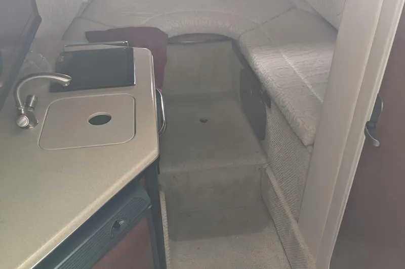 Slide: The Image of 2005 Sea Ray 260 Sundancer in covered marina. - 11