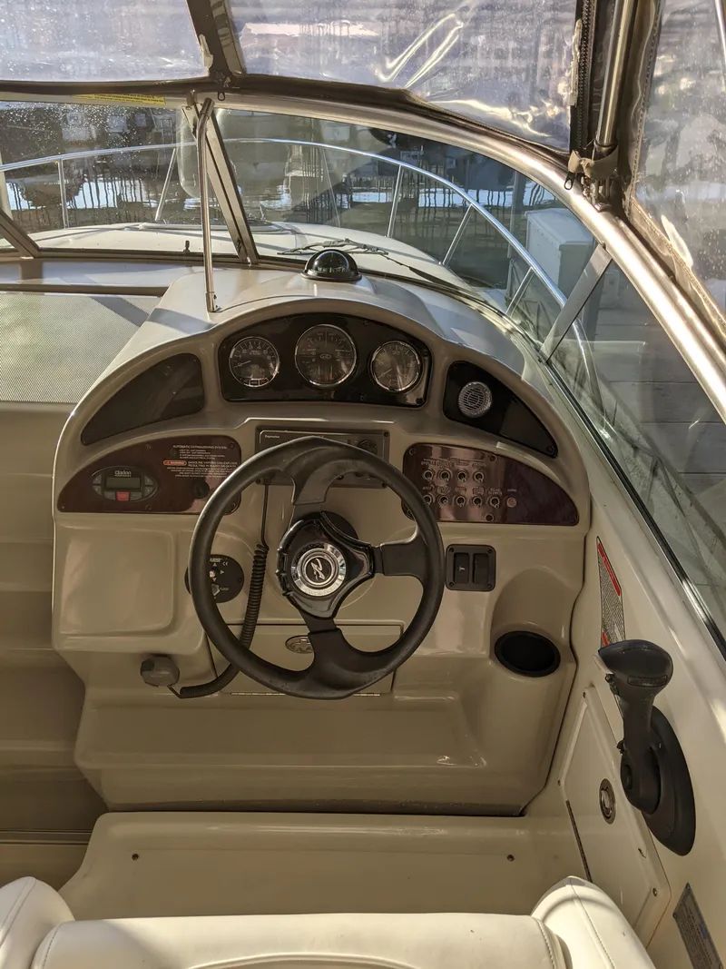 Slide: The Image of Steering console of a 2005 Sea Ray 260 Sundancer boat. - 13