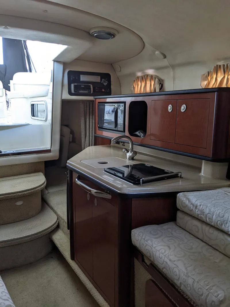 Slide: The Image of Dashboard of a 2005 Sea Ray 260 Sundancer boat. - 16