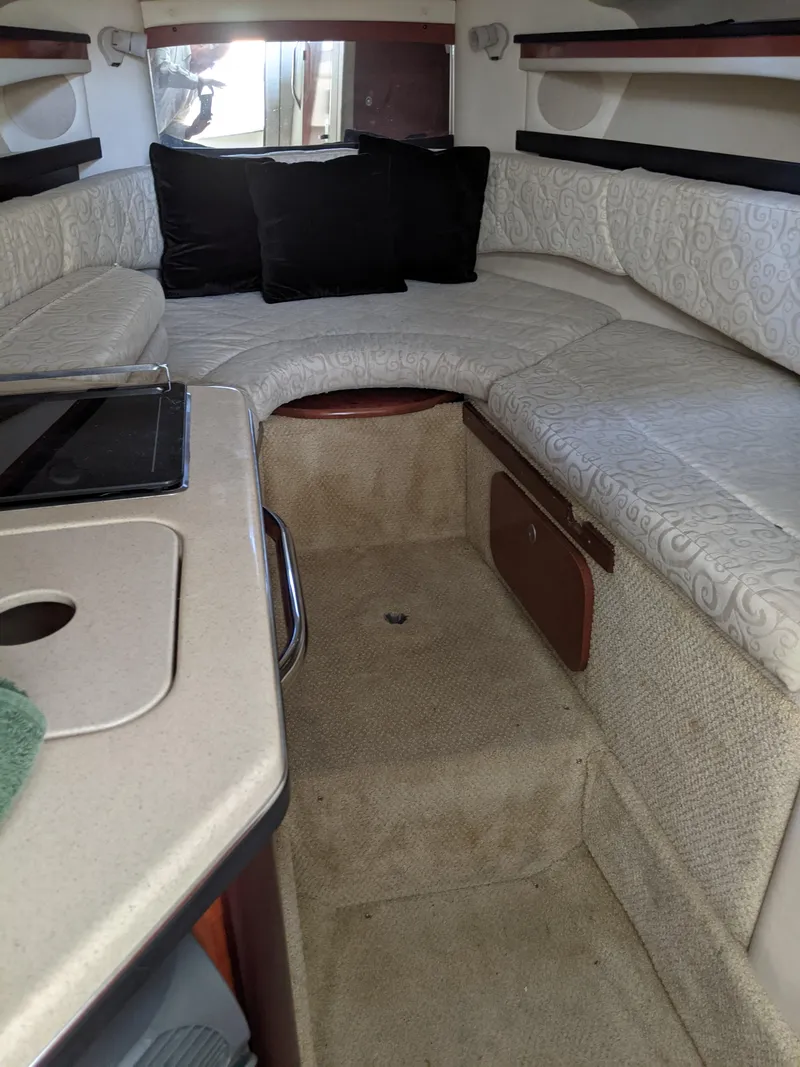 Slide: The Image of 2005 Sea Ray Sundancer 260 boat interior with sink and seating area. - 22