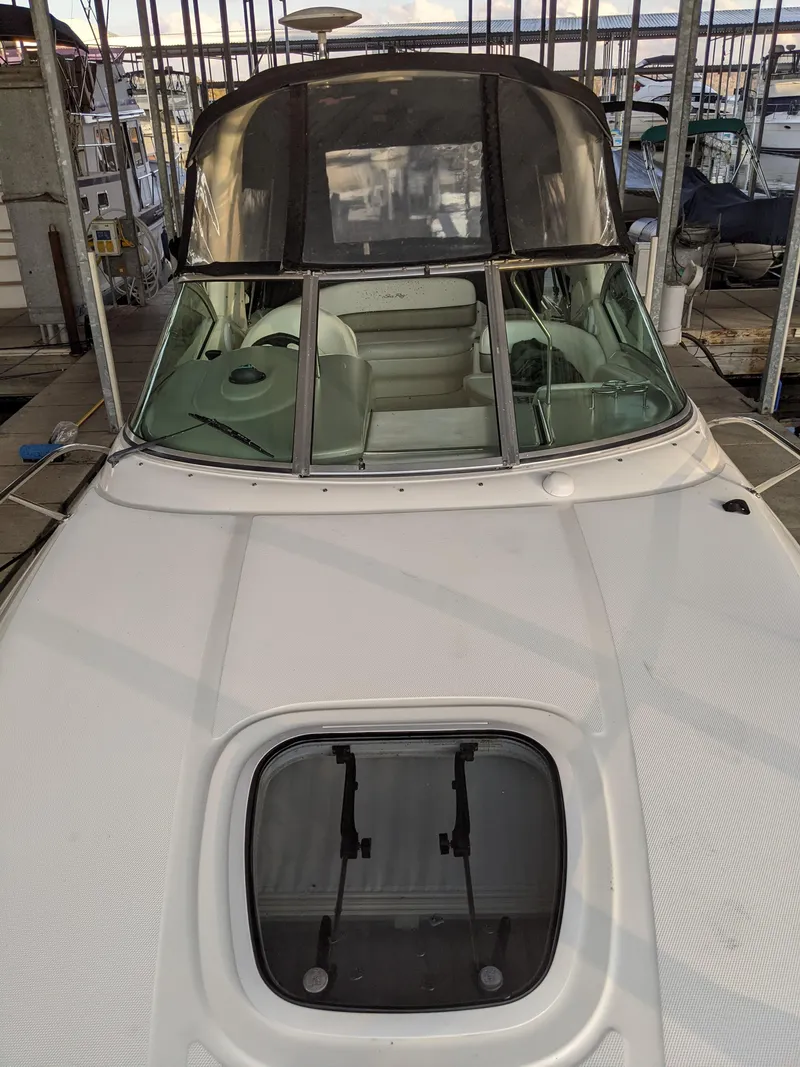 Slide: The Image of Interior of 2005 Sea Ray Sundancer 260, featuring wood paneling and a speaker. - 31