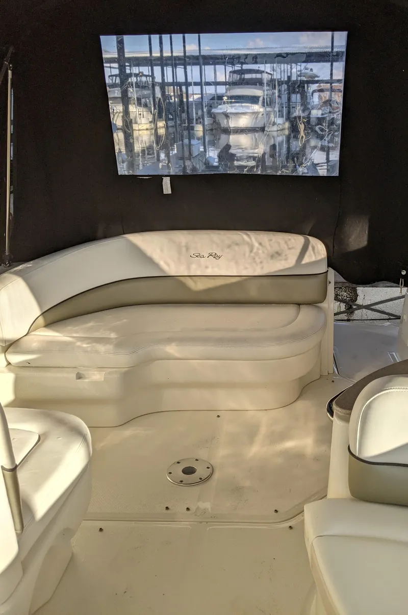 Slide: The Image of Interior of a 2005 Sea Ray 260 Sundancer with curtains and wood paneling. - 32