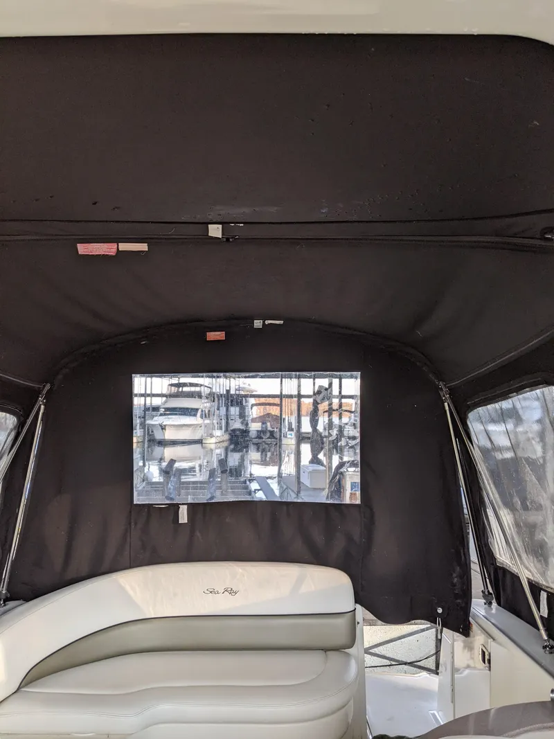 Slide: The Image of Interior of a 2005 Sea Ray 260 Sundancer with ceiling-mounted TV. - 33