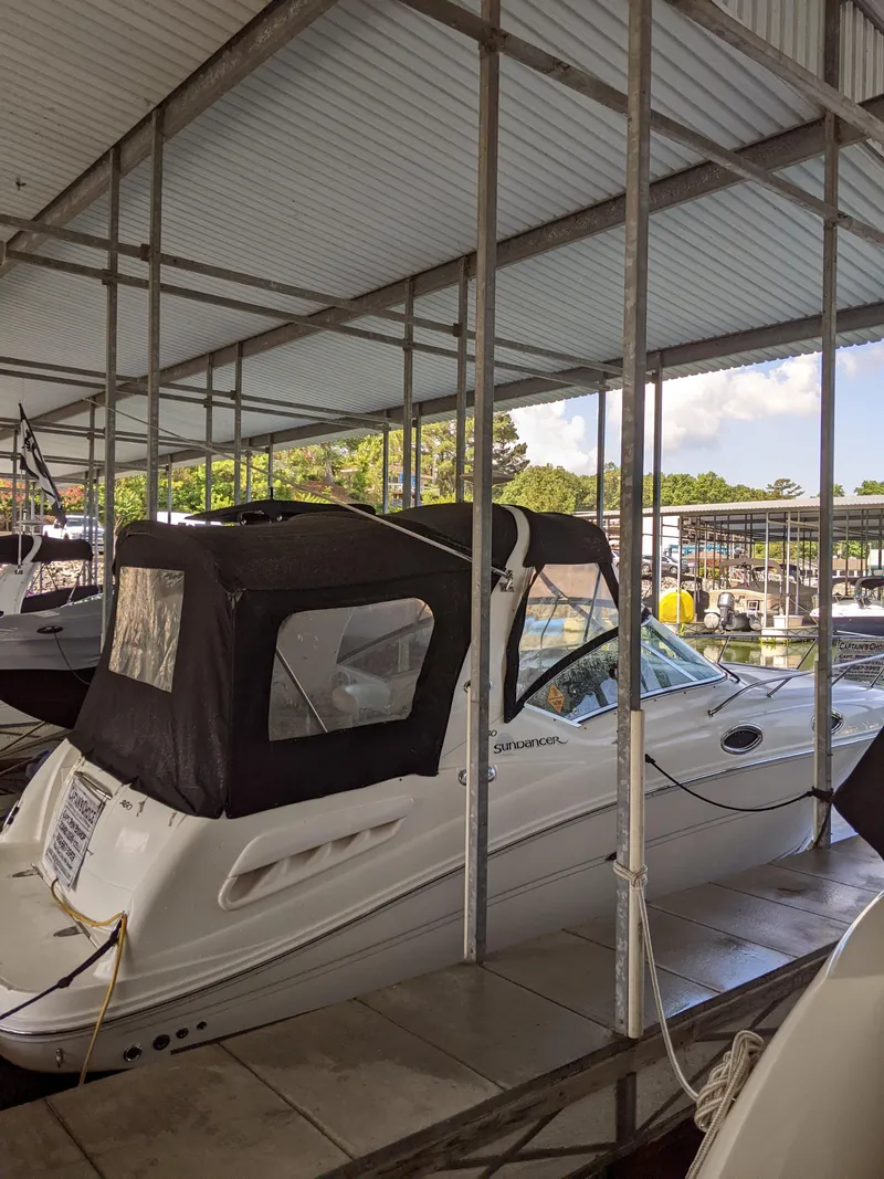 Slide: The Image of 2005 Sea Ray 260 Sundancer docked in covered marina. - 4