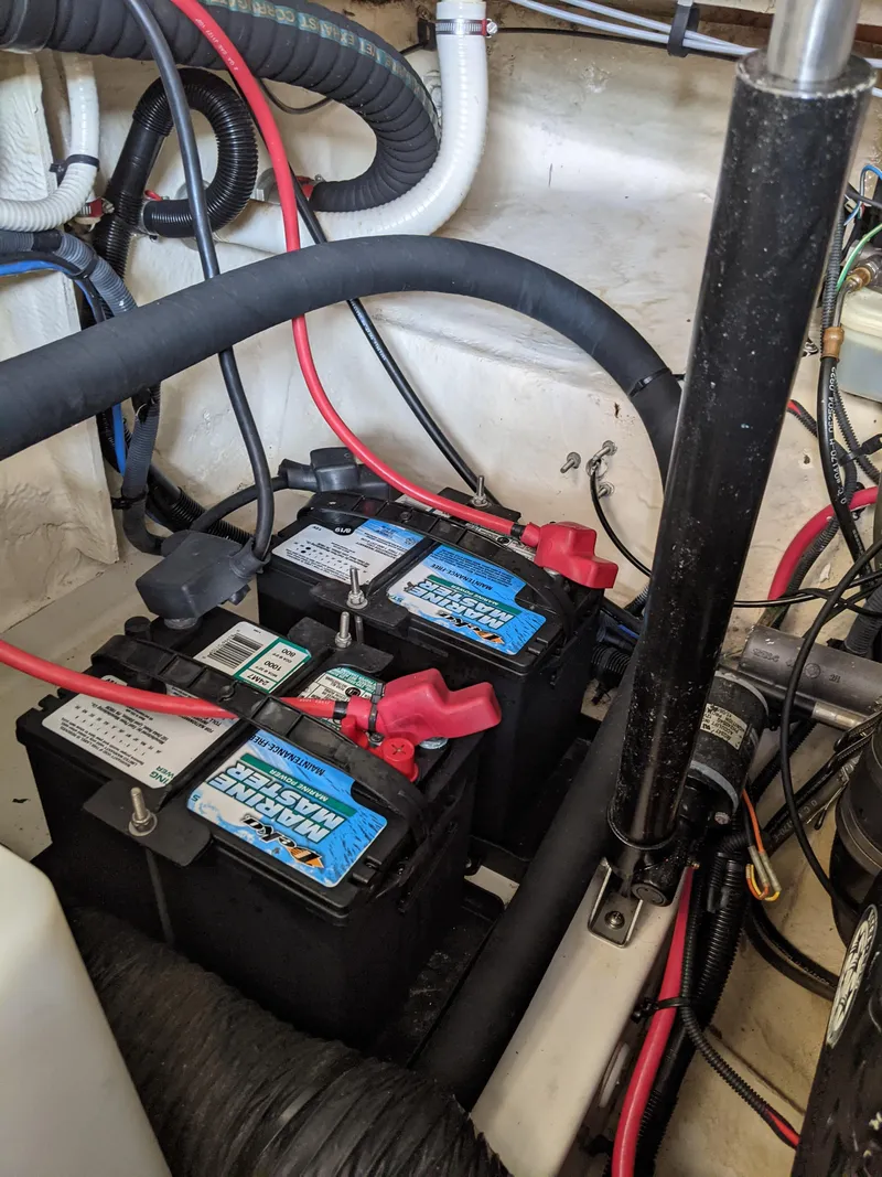 Slide: The Image of Batteries in the engine compartment of a 2005 Sea Ray 260 Sundancer boat. - 51