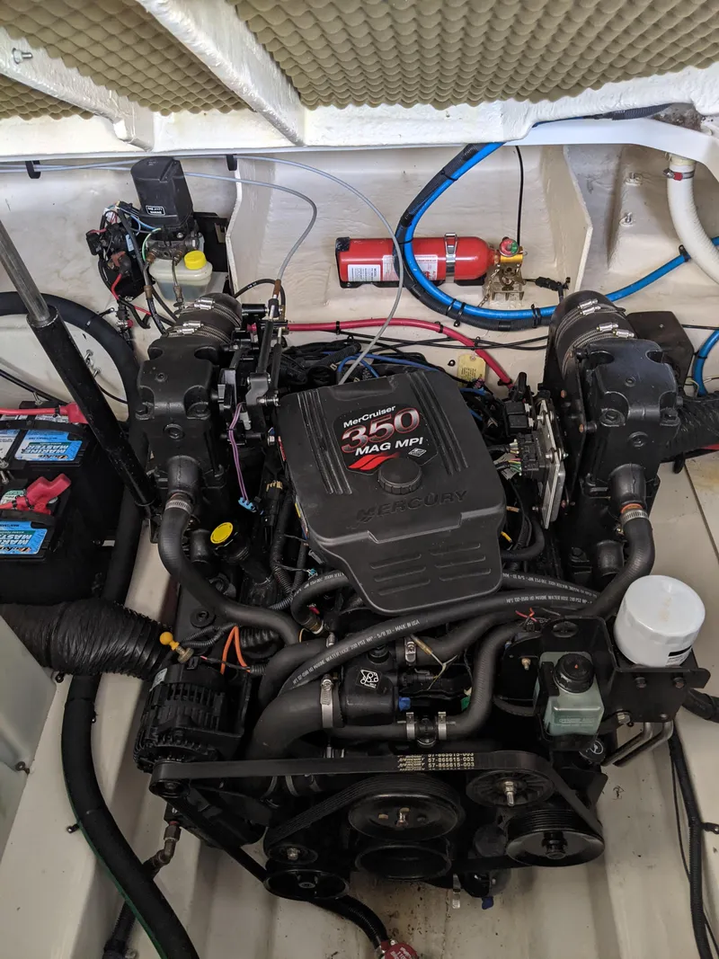 Slide: The Image of Engine compartment of a 2005 Sea Ray 260 Sundancer boat. - 53