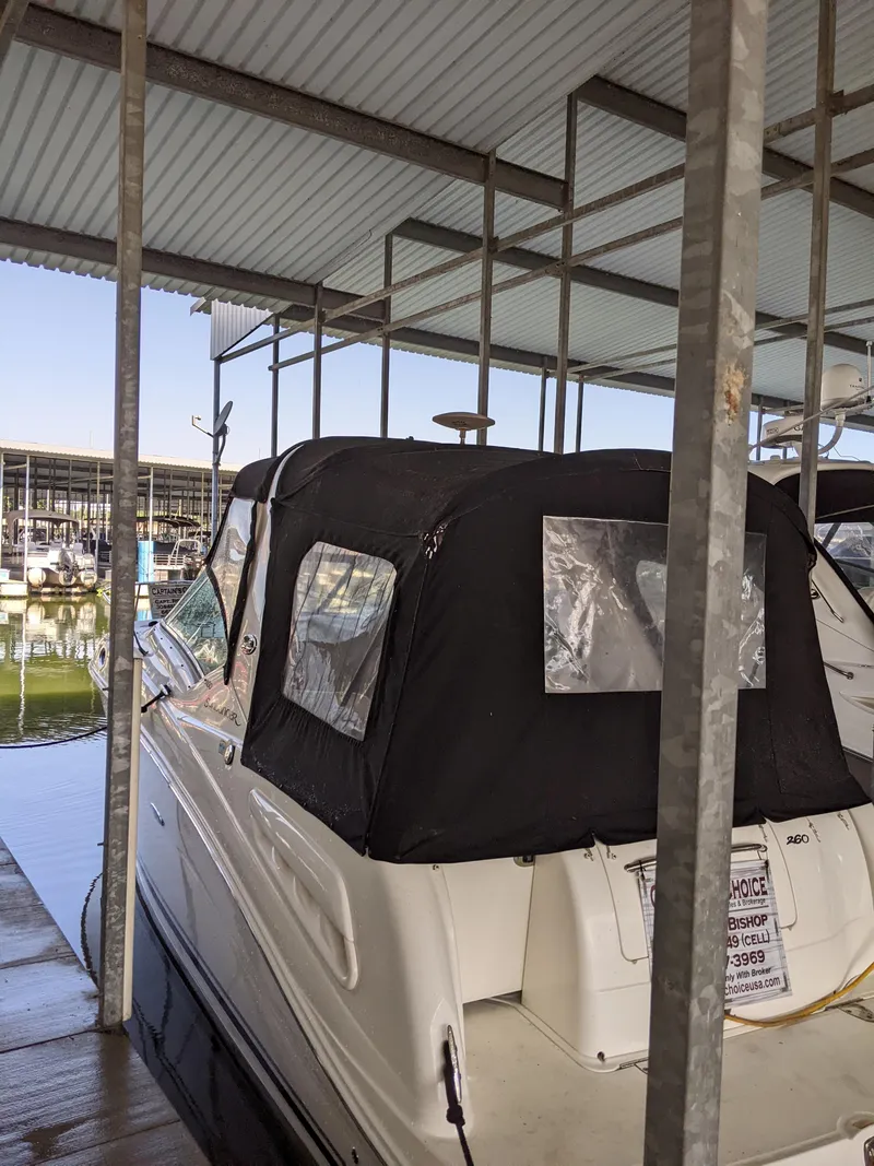 Slide: The Image of Interior of a 2005 Sea Ray 260 Sundancer with black canopy. - 9