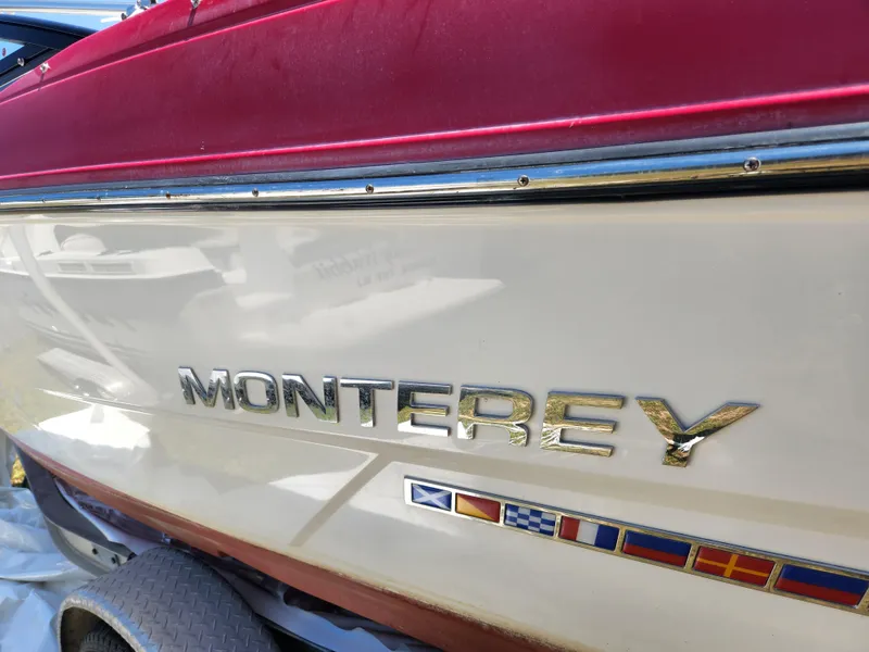 Slide: The Image of 2014 Monterey 234 SS boat with red and white exterior. - 12