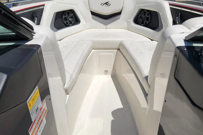 Slide: The Image of Interior of a 2014 Monterey 234 SS boat with white seating and speakers. - 15