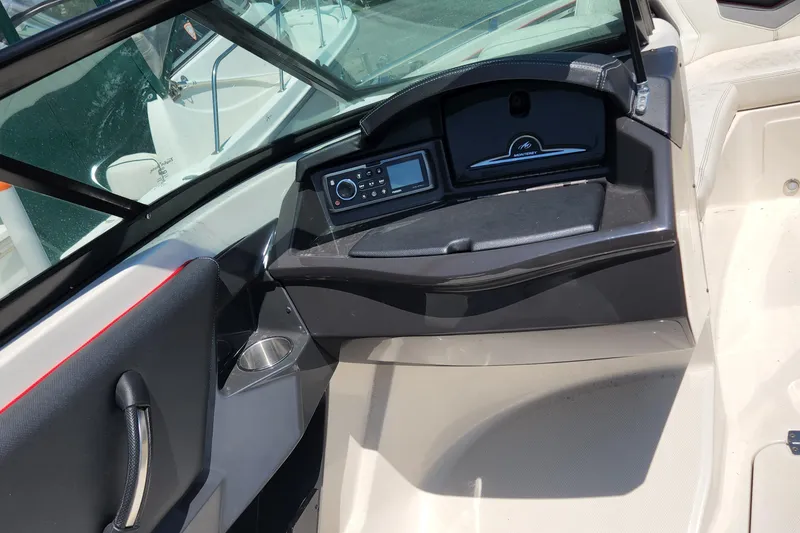 Slide: The Image of 2014 Monterey 234 SS boat dashboard and control panel. - 10