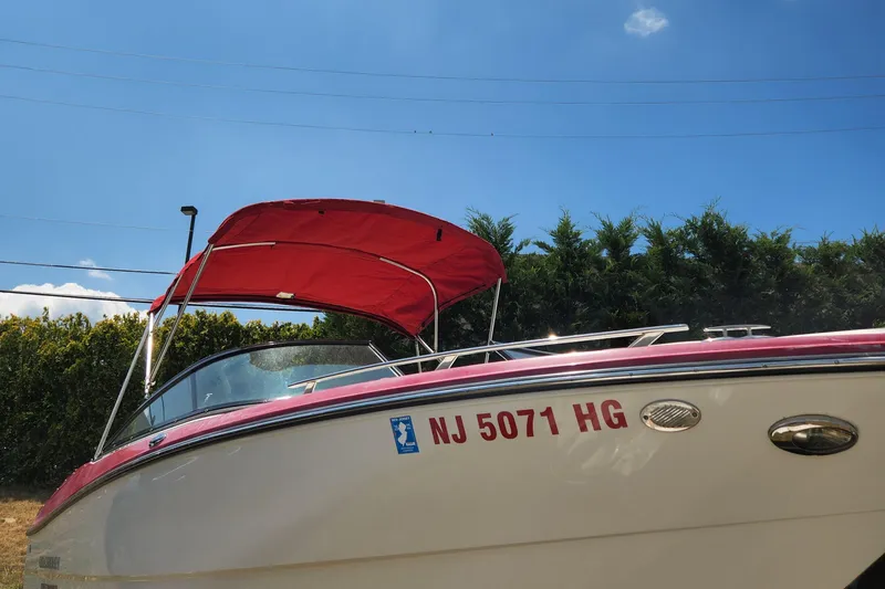 Slide: The Image of 2014 Monterey 234 SS boat with red canopy and NJ 5071 HG registration. - 6