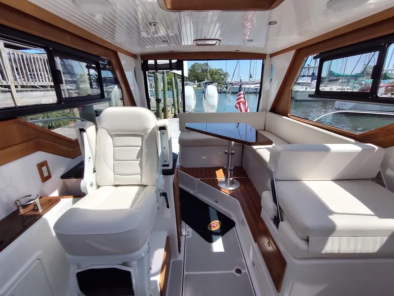 Slide: The Image of Interior of 2023 True North 34 OE boat with luxurious seating and elegant design. - 13